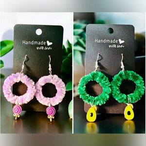 Two hoop earrings with lollipop charm